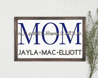 Personalized wood sign with "My Greatest Blessings Call Me Mom" design, customizable with children's names, framed and available in multiple sizes.