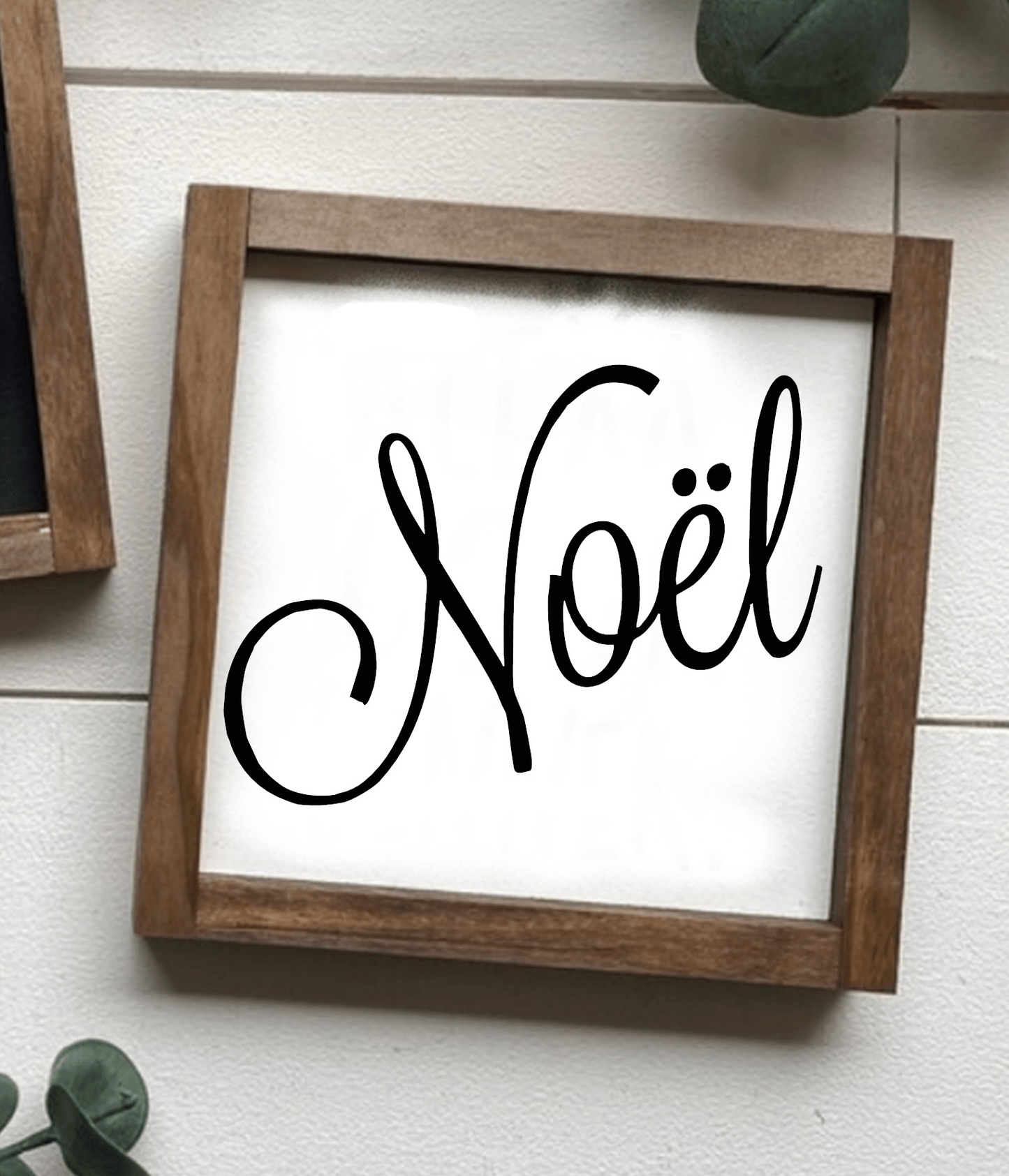 Handcrafted "Noel" framed wood sign with black lettering on a white background, perfect for festive home decor.