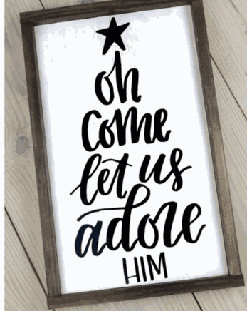 Christmas handmade framed sign with "Oh Come Let Us Adore Him" in black lettering on white background.