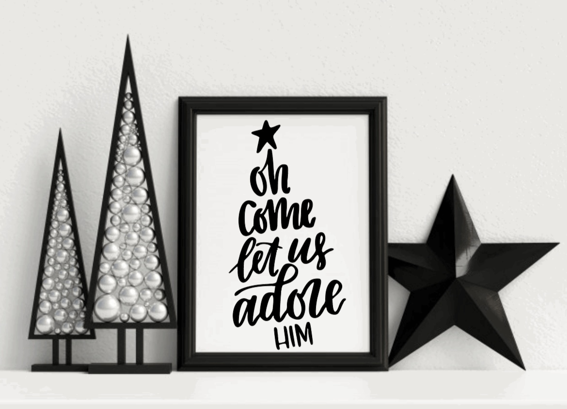 Christmas framed wood sign with "Oh Come Let Us Adore Him" text, black lettering on white background.