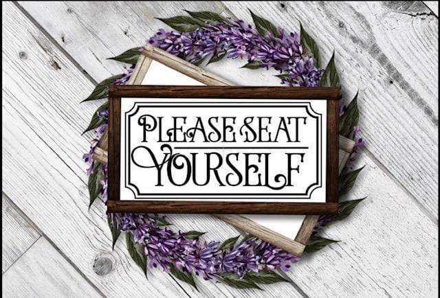 Handcrafted wood bathroom sign with "Please Seat Yourself" message.