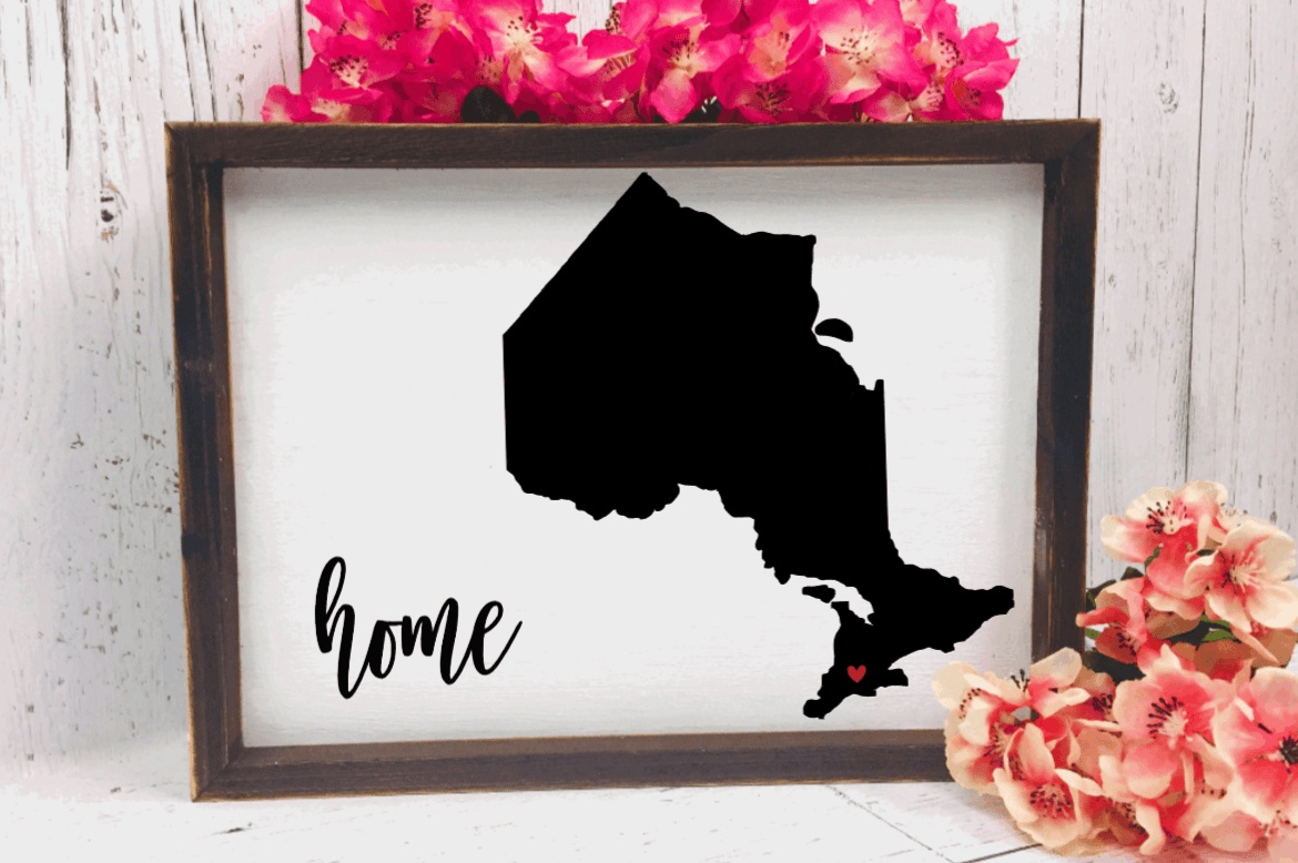 Rustic wood home sign with customizable state outline and personalized red heart location.