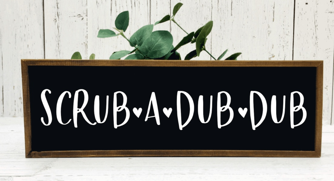 Handmade wood bathroom sign with "Scrub A Dub Dub" text on black background.