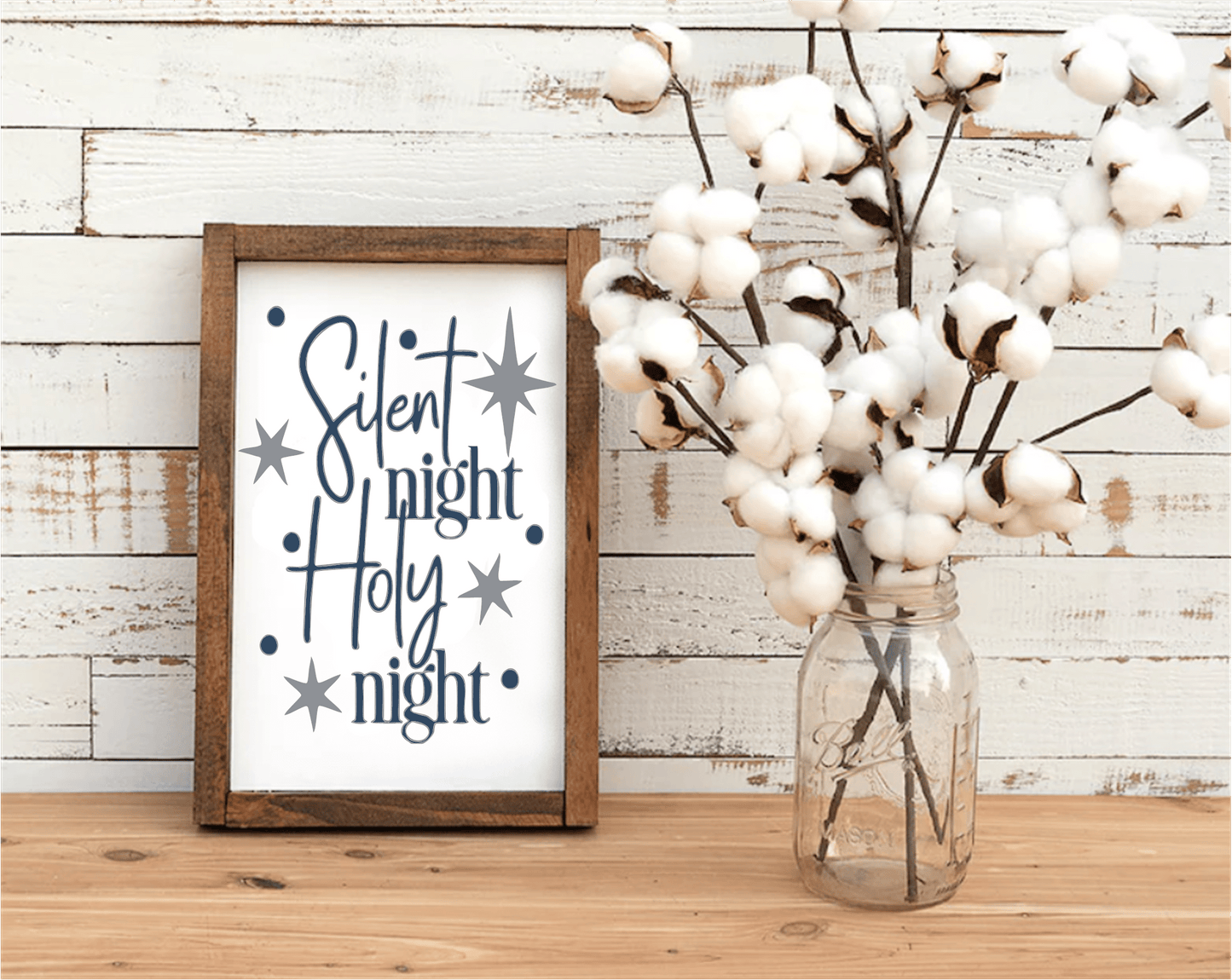 Silent Night Holy Night framed wood sign with white background and blue lettering, stained pine frame.
