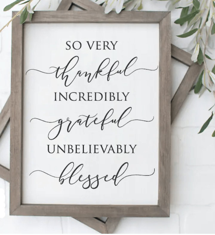 Rustic wood sign with "So Very Thankful Grateful Blessed" message, farmhouse style decor.
