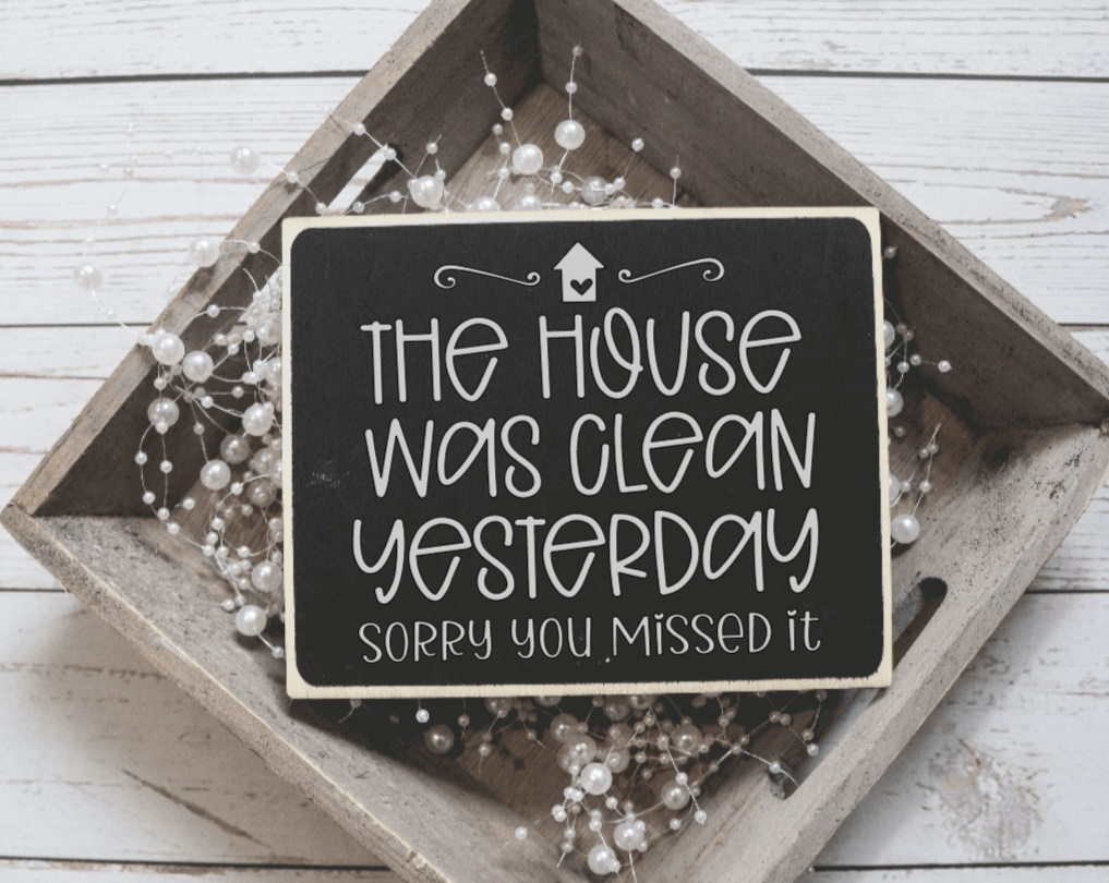 Handmade wood sign with "The House was Clean Yesterday" quote, black background, rustic decor.