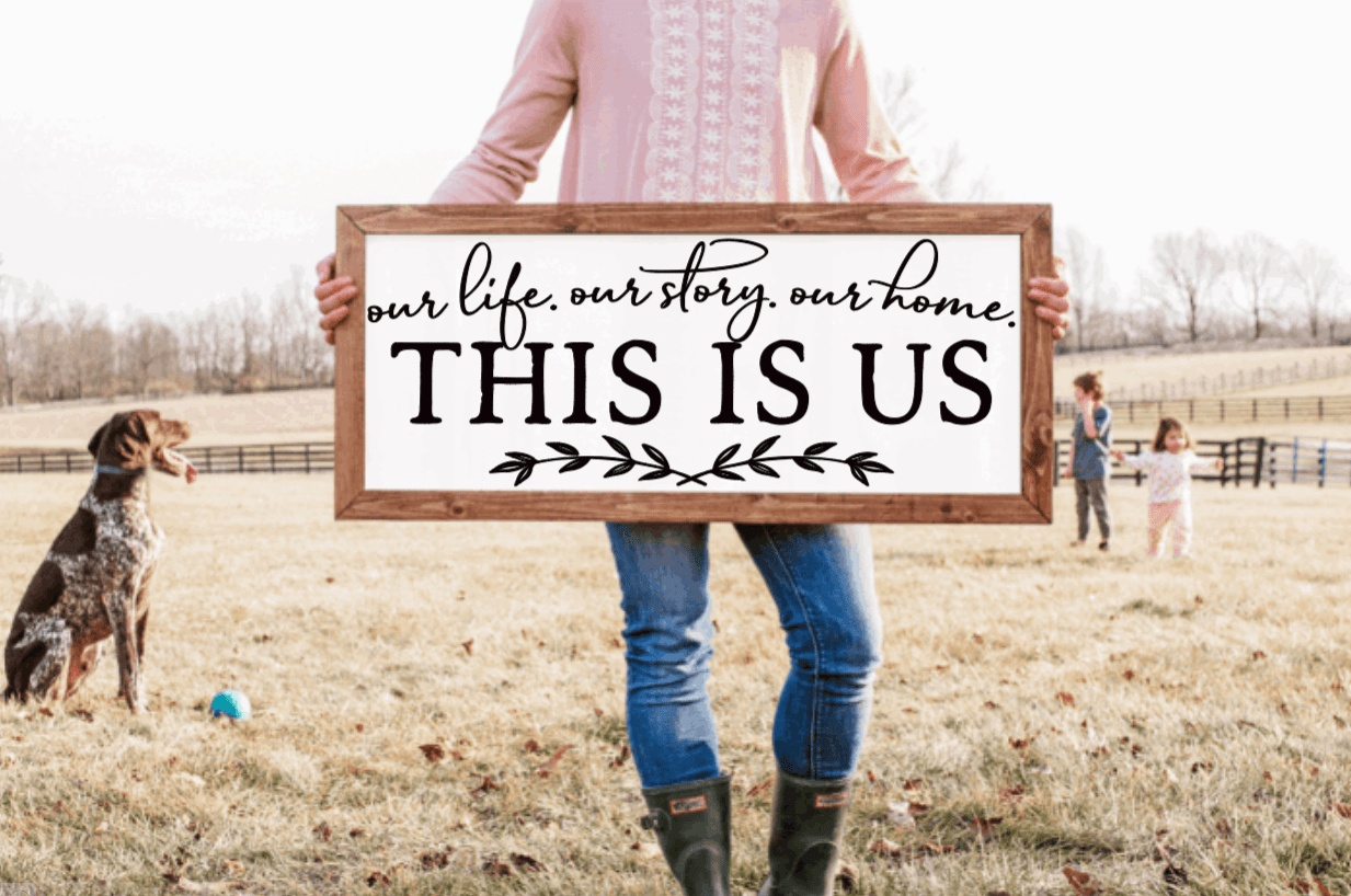 Framed farmhouse wood sign with "This is Us" text.