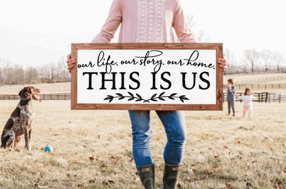 Framed farmhouse wood sign with "This is Us" text.