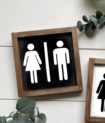 Unisex bathroom sign with frame, wood decor, black and white design, customizable for modern or rustic style.