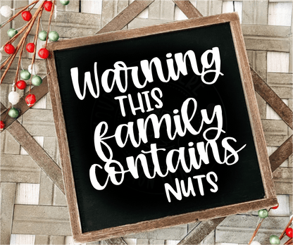 Handcrafted framed wood sign with "Warning This Family Contains Nuts" text on black background with white lettering.