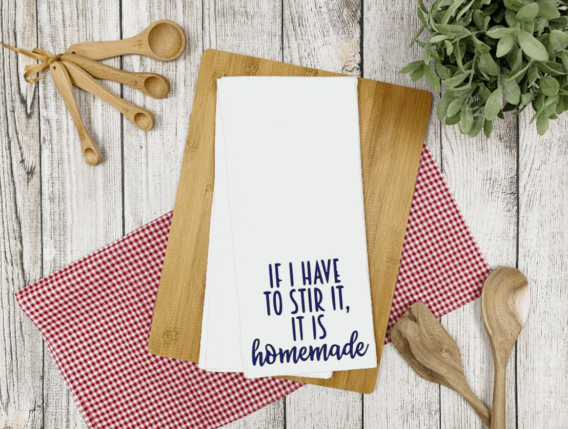 Humorous tea towel with "If I have to Stir it, it is Homemade" design, white microfiber, waffle weave, perfect gift.