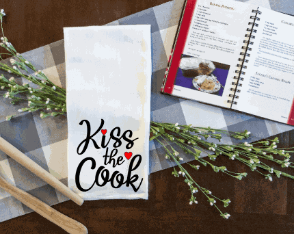 Kiss the Cook tea towel with funny saying design, microfiber, ultra-soft, lint-free, ideal for kitchen use.