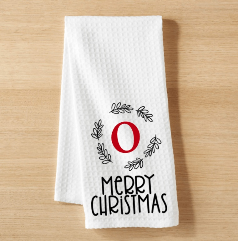 Personalized monogram Christmas tea towel with initial and Merry Christmas design.
