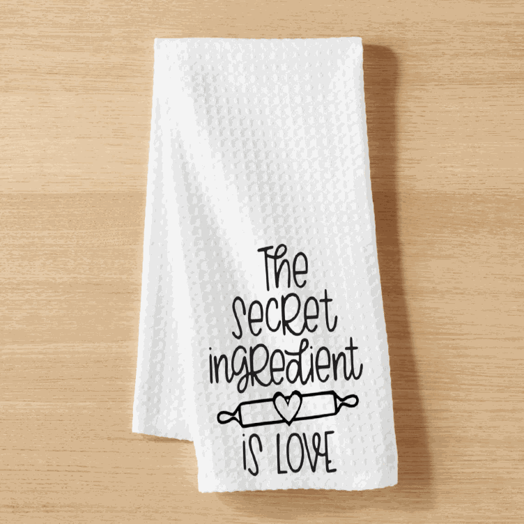 "The Secret Ingredient is Love" white waffle weave tea towel, microfiber, lint-free, super absorbent, 16x24 inches.