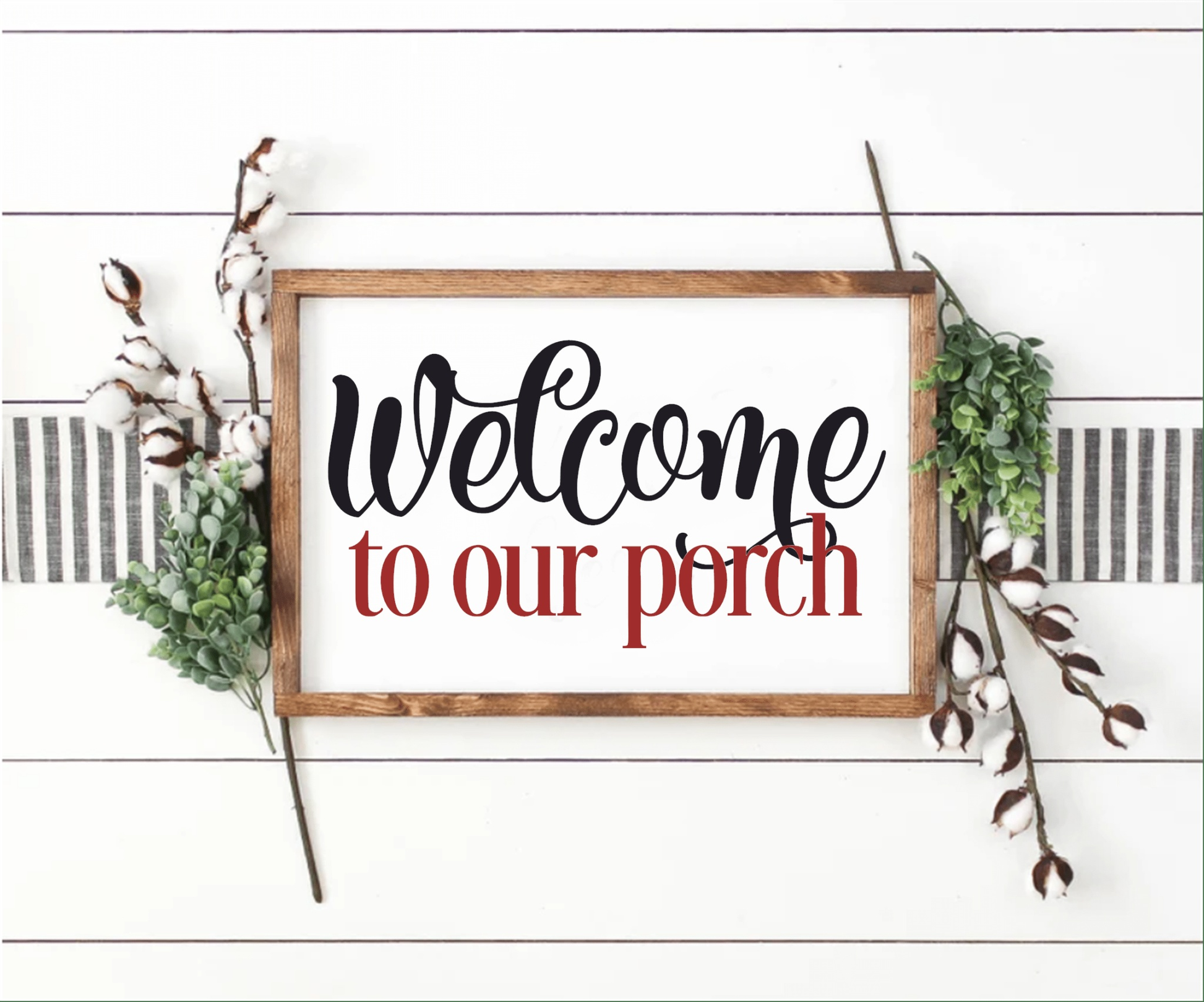 Welcome To Our Porch wood sign with stained frame and decorative greenery.