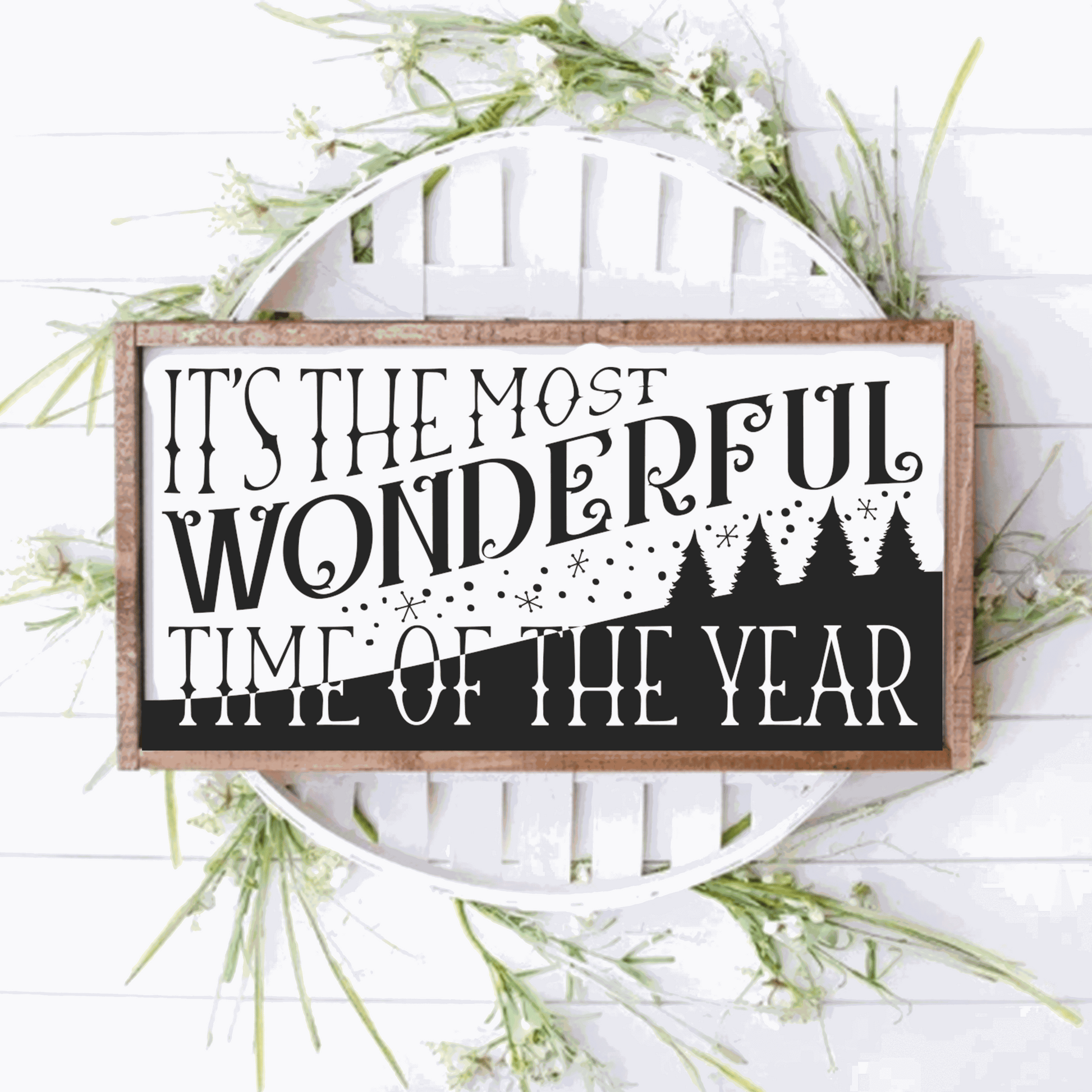 Framed wood sign with "It's the Most Wonderful Time of the Year" text surrounded by greenery, 10x20 inches.