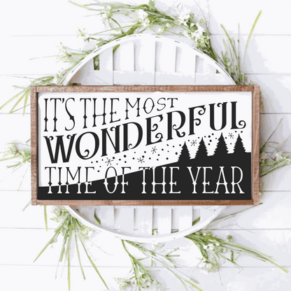 Framed wood sign with "It's the Most Wonderful Time of the Year" text surrounded by greenery, 10x20 inches.